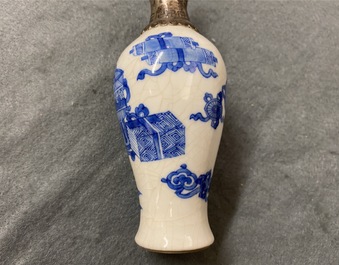 Three Chinese silver-mounted blue and white vases and a teapot, Kangxi